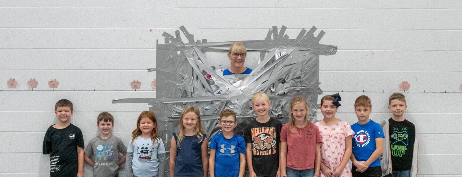 Fundraiser Principal Sue Stringfield taped to the wall